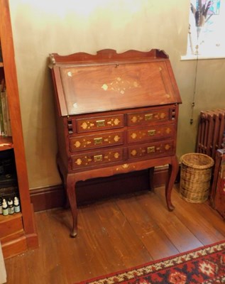 Lot 586 - A brass inlaid bureau, raised on cabriole legs,...