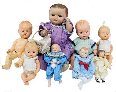 Lot 137 - Ceramic celluloid and other dolls, including...