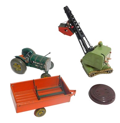 Lot 203 - AMFZ tinplate tractor crane and a tinplate...