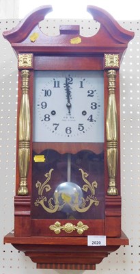 Lot 2030 - A Polaris wall clock, in a redwood case with...