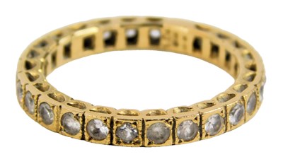 Lot 85 - An 18ct gold and diamond eternity ring, set...