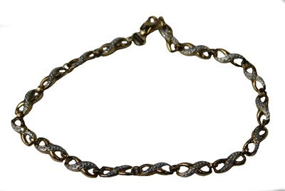 Lot 227 - A 9ct gold bicolour bracelet, with S links, in...