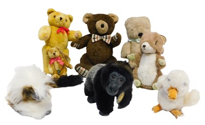 Lot 520 - A group of soft toys, to include a...