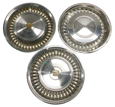 Lot 34 - Two Cadillac chrome hub cap covers and an...