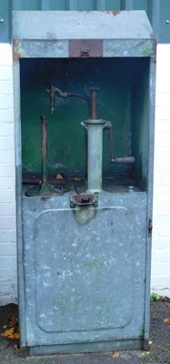 Lot 73 - An oil pump cabinet, in green, bearing plaque...