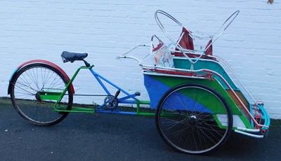 Lot 680 - An Eastern rickshaw, with partial canopy,...