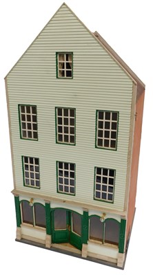Lot 688 - A doll's house, with a ground floor shop,...