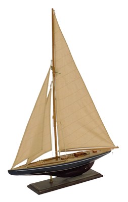 Lot 739 - A wooden model of a sailing yacht, with a...