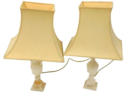 Lot 46 - A pair of alabaster table lamps, with foliate...