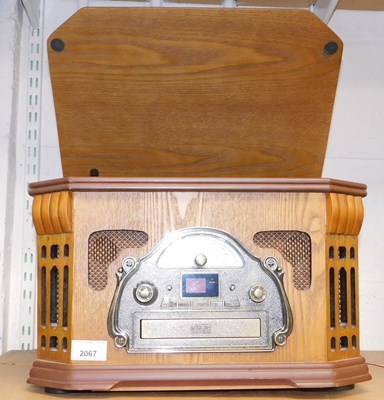 Lot 2067 - A Steepletone music centre, in the style of a...