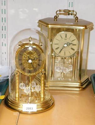 Lot 2083 - A pair of decorative Hermle quartz mantel...