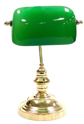 Lot 58 - A brass desk lamp, with an angular green and...