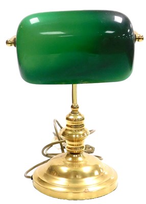 Lot 60 - A brass desk lamp, with an angular green and...