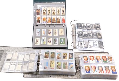 Lot 138 - Cartophily Cigarette cards, in four albums,...