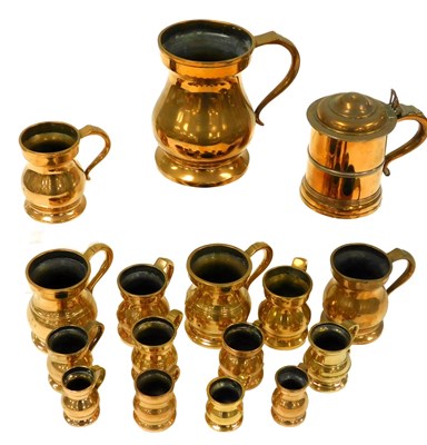 Lot 204 - A group of 19thC brass beer flagons, measures,...