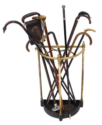 Lot 177 - A Victorian brass and cast iron stick...