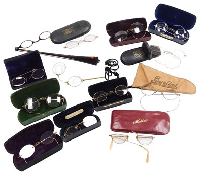 Lot 179 - A group of early 20thC spectacles, cased,...