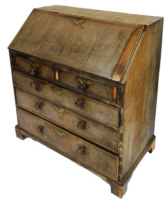 Lot 560 - A George III mahogany bureau, the fall flap...
