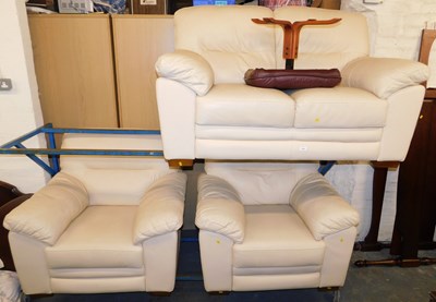 Lot 1005 - A cream four piece leather suite, consisting...