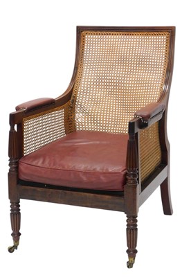 Lot 359 - A Regency mahogany bergere library chair, with...