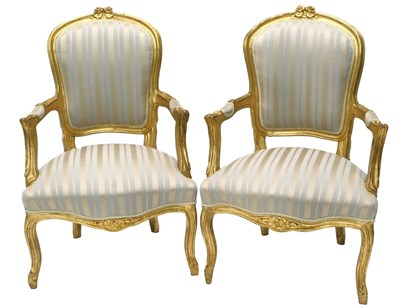 Lot 372 - A pair of gilt fauteuil in French style, each...