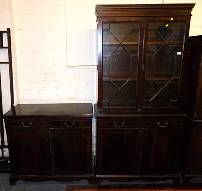 Lot 1024 - A semi-glazed display cabinet, with two doors...