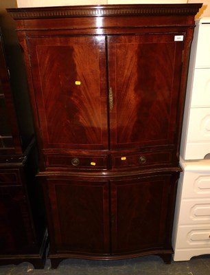 Lot 1025 - A mahogany serpentine fronted storage unit,...