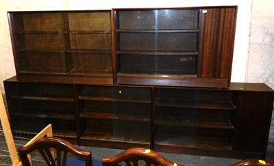 Lot 1028 - A set of teak glass fronted display cabinets,...