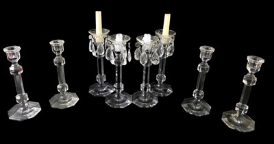 Lot 68 - A set of eight faceted cut glass candlesticks,...