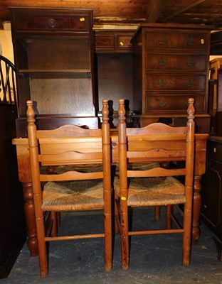 Lot 1033 - A pine kitchen table, with four pine ladder...