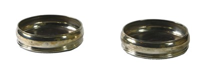 Lot 89 - A pair of silver coasters, each with a...