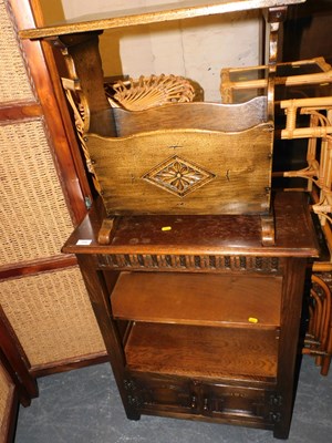 Lot 1046 - A hardwood cupboard bookcase, with two doors...