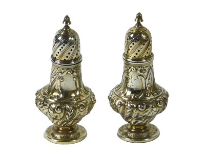 Lot 112 - A pair of Victorian silver pepper pots, each...