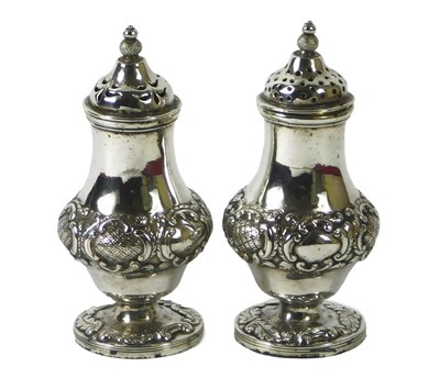 Lot 111 - A pair of mid 19thC Indian white metal pepper...