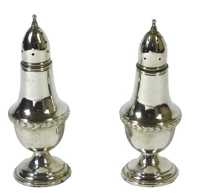 Lot 122 - A pair of 19thC silver peppers, each with a...