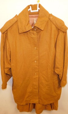 Lot 2347 - A burnt orange lady's jacket, with skirt, size...