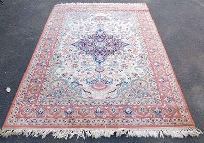 Lot 1083 - A machine woven rug, 240cm x 170cm.