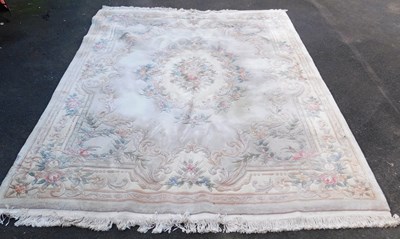 Lot 1084 - A Chinese pink ground wool rug, 310cm x 245cm.