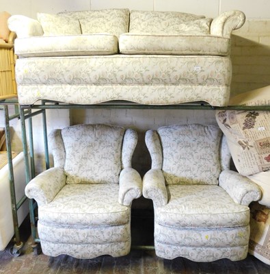 Lot 1077 - A two seater sofa, together with two matching...