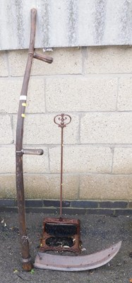 Lot 1097 - A Scythe, together with a cast iron boot scraper.