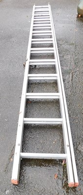 Lot 1099 - A metal extending step ladder.
