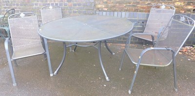Lot 1101 - A cast metal circular topped dining table,...
