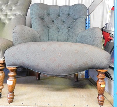 Lot 1108 - A 20thC button back armchair.