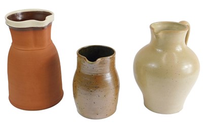 Lot 321 - A 19thC buff coloured stoneware jug, 22cm high,...