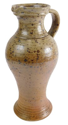 Lot 324 - A brown stoneware baluster jug, of coiled...