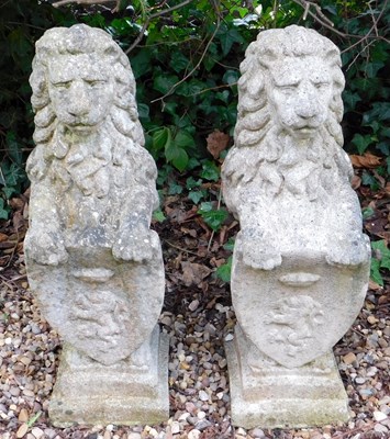 Lot 402 - A pair of reconstituted stone heraldic...