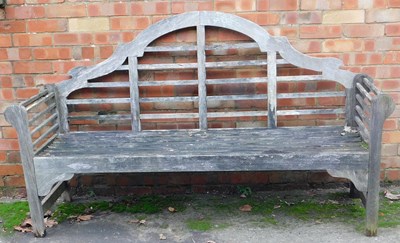 Lot 409 - A Lutyens style hardwood garden bench, 180cm...