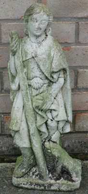 Lot 411 - A carved stone figure of a man holding a staff...