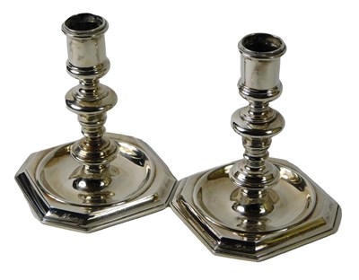 Lot 95 - A pair of modern silver cast candlesticks, in...