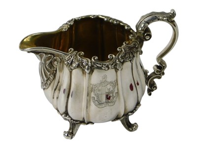 Lot 113 - A George IV silver cream jug, cast overall...
